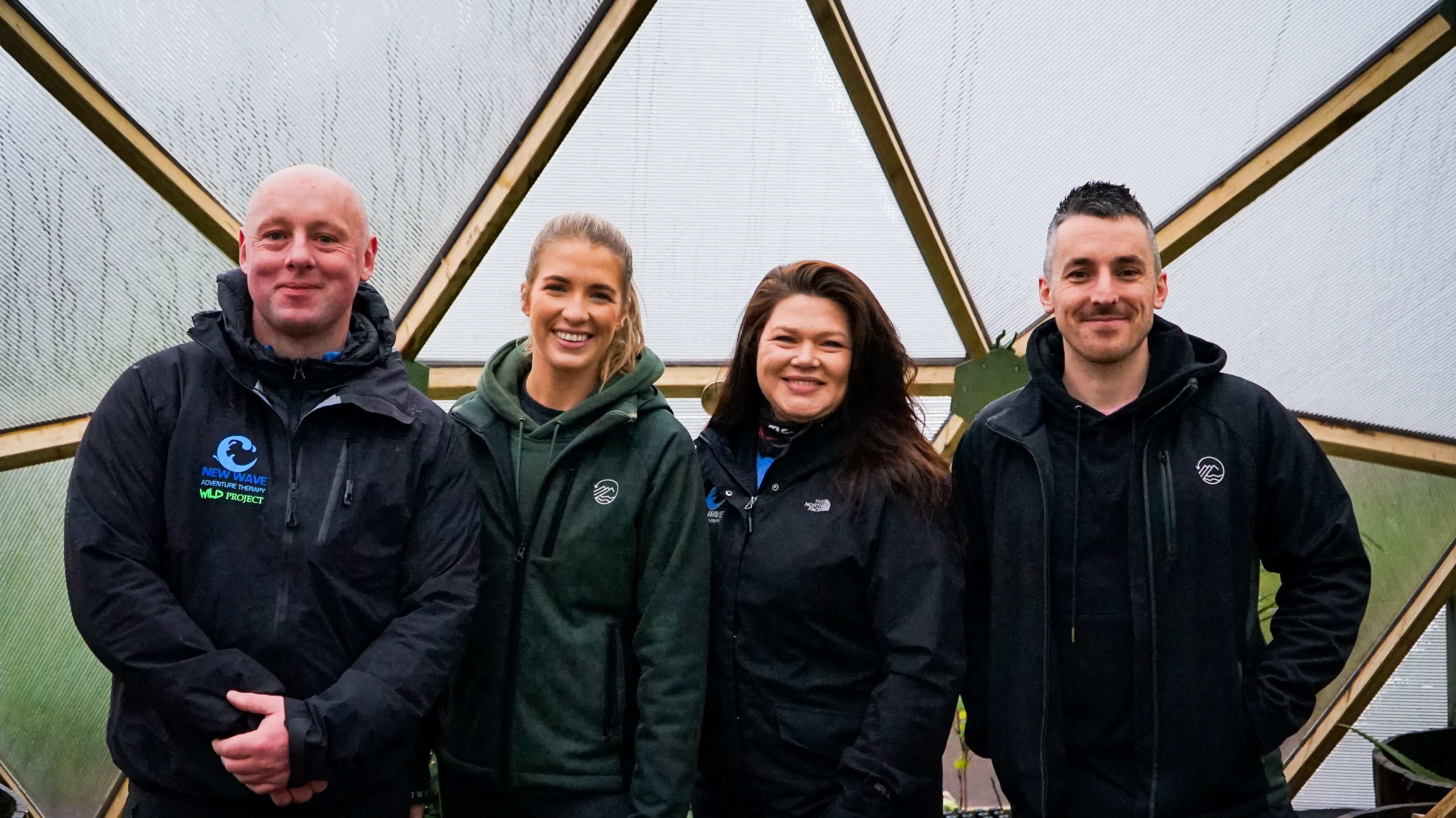 Shane and Rebecca from Outwest posing with the New Wave Wild Project team