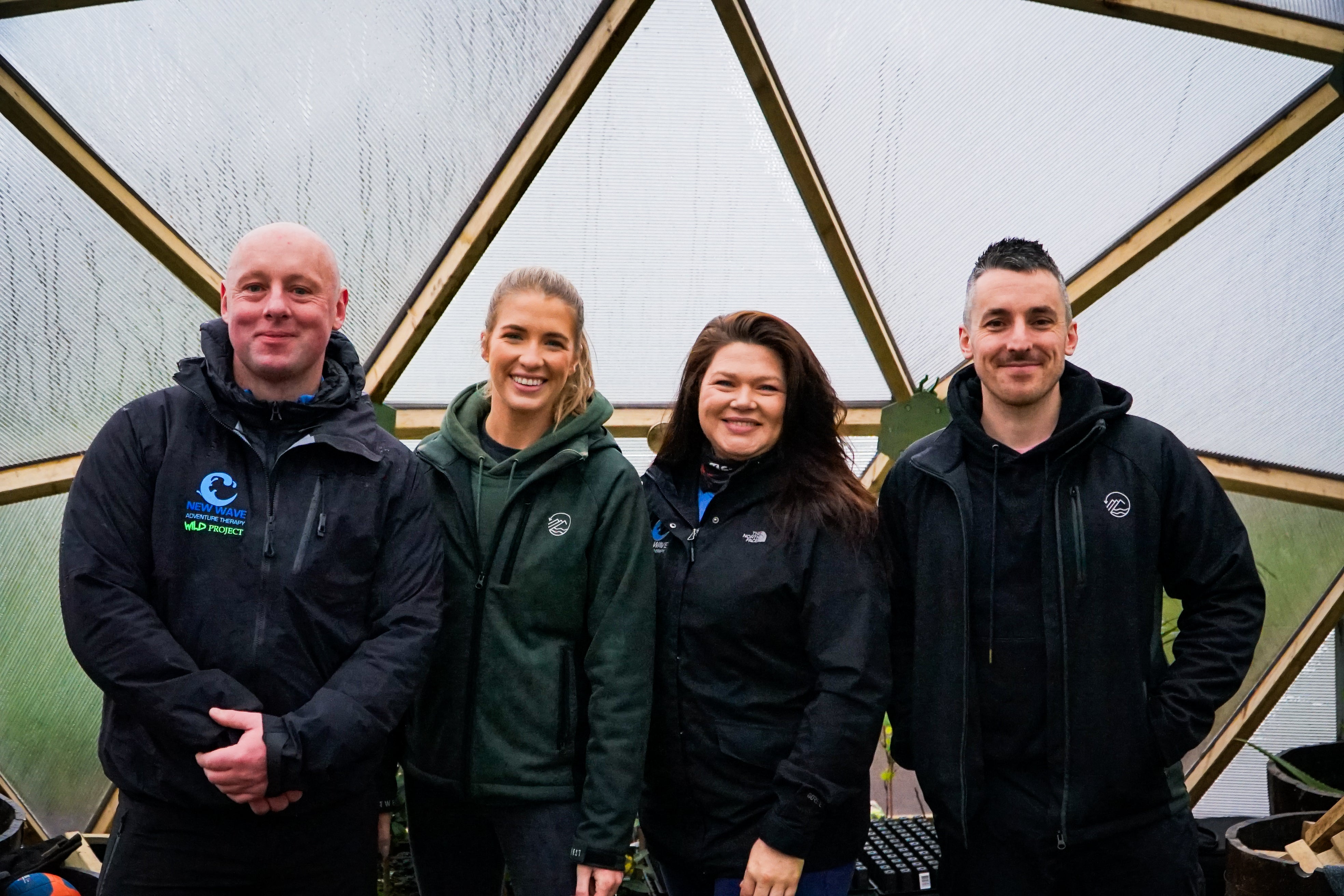 Shane and Rebecca from Outwest posing with the New Wave Wild Project team